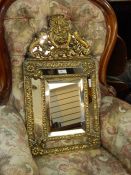 Victorian brass wall mirror in 17th century Flemish style, having scallopshell scroll and fruit