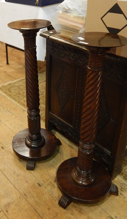 Pair of early 19th century-style mahogany torcheres with stiff leaf carved terminals to the spirally