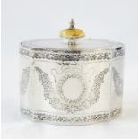 Mid 19th century silver lozenge-shaped tea caddy with ivory domed disc handle above the engraved