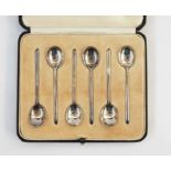 Set of six silver coffee spoons, slip top, Sheffield assay, in case and an Edwardian card case,