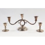 Pair of weighted silver squat candle holders with collared stems, circular bases, Birmingham 1925,