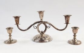 Pair of weighted silver squat candle holders with collared stems, circular bases, Birmingham 1925,