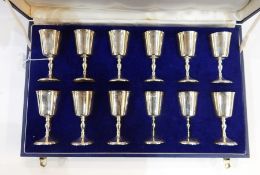 Set of 12 silver and parcel gilt sherry goblets, each with bucket-shaped bowl, baluster stem and