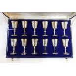 Set of 12 silver and parcel gilt sherry goblets, each with bucket-shaped bowl, baluster stem and