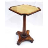 Antique rosewood occasional table, the square glass top with incuse corners, on panelled tapered