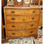 Reproduction figured walnut serpentine-front chest of four long drawers with brass drop handles