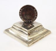 Victorian silver paperweight of rectangular form with bead border decoration, surmounted by a George