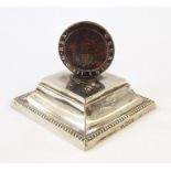 Victorian silver paperweight of rectangular form with bead border decoration, surmounted by a George