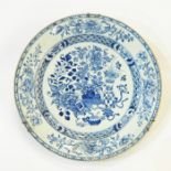 Chinese porcelain charger painted in underglaze blue with precious objects, peonies and flowering