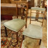Set of four Edwardian inlaid mahogany dining chairs, each with curved and scroll top rail, festoon