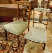 Set of four Edwardian inlaid mahogany dining chairs, each with curved and scroll top rail, festoon
