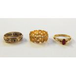 Gold-coloured dress ring set with pink stone, eternity ring and gold-coloured ring set with white