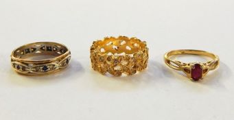 Gold-coloured dress ring set with pink stone, eternity ring and gold-coloured ring set with white