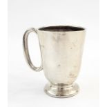 Small silver christening cup, Birmingham (marks rubbed) and a single silver pepperette 1887 (2)