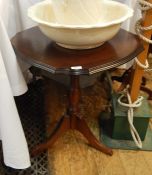 Reproduction mahogany occasional table, circular with serpentine edge, on turned column tripod base,