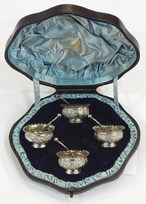 Set of four Victorian silver personal salts and matching spoons, London 1884, each scroll repousse