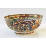 Chinese porcelain punch bowl in famille rose colours, decorated with figures on a lakeside