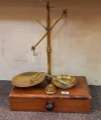 Pair brass and mahogany balance scales, the mahogany base with single drawer with turned knob handle