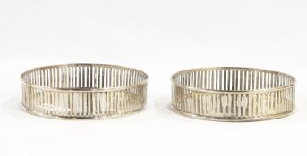 Pair Austro-Hungarian silver-coloured metal wine coasters, each circular and with pierced grille