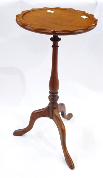 Stained wood tripod wine table having scallop carved edge, on baluster column, three scroll