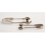 Pair of silver fiddle pattern sugar tongs, London 1877 and a pair of silver apostle pattern coffee