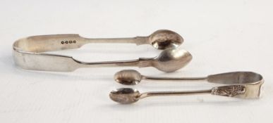 Pair of silver fiddle pattern sugar tongs, London 1877 and a pair of silver apostle pattern coffee