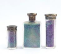 Three silver-mounted glass toilet jars, varying sizes, initialled (3)