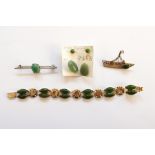 Gold-coloured metal and jade-coloured stone set bracelet, Oriental green stone set silver brooch,