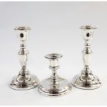 Pair of 20th century silver candlesticks, Birmingham 1955, makers 'ESC' and a further weighted