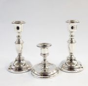 Pair of 20th century silver candlesticks, Birmingham 1955, makers 'ESC' and a further weighted