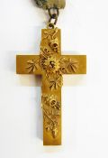 Victorian gold-coloured metal cross locket pendant applied with passion flower decoration and having