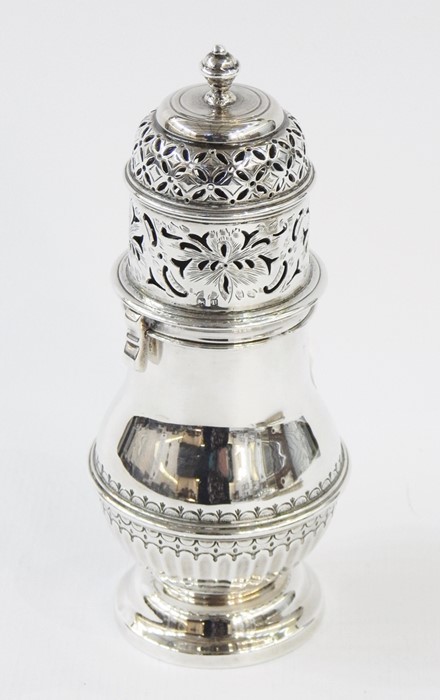 Early 20th century silver sugar caster with turned finial above the twist lock, pierced and engraved