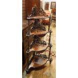 Victorian inlaid figured walnut four-tier whatnot with pierced scroll fretwork to each tier,