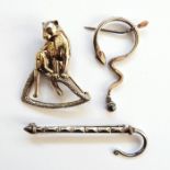 Silver leopard brooch on branch, a star-shaped brooch and a serpent brooch with pendant drop (3)