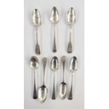 Eight assorted, mainly Old English pattern, dessert spoons, various makers to include George II