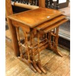 Reproduction mahogany nest of trio occasional tables, rectangular, on slender double-turned standard