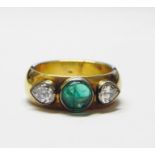 18ct gold, emerald and diamond ring set central circular cabochon emerald flanked by two pear-shaped