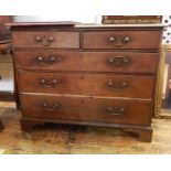 Oak chest of two short and three long drawers with brass swing handles, on bracket feet, 109cm
