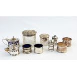 Three-piece silver condiment set with blue glass liners, three other assorted condiment items with