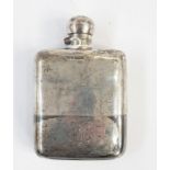 Early 20th century silver hip flask, the bayonet cap above the plain body, removable cup section
