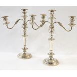 Pair of EPNS table candelabra, each three-light with pair reflex scroll branches, on tapering