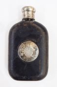 Old leather-bound glass spirit flask having silver-coloured metal circular monogram engraved