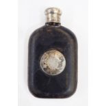 Old leather-bound glass spirit flask having silver-coloured metal circular monogram engraved