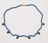 9ct gold and blue agate frog pendant necklace with gold clasp, from Woodyard, Ludlow