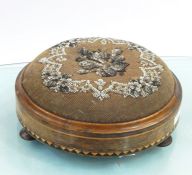 Pair of Berlin Work circular covered footstools on three pad feet, walnut, with geometric inlay