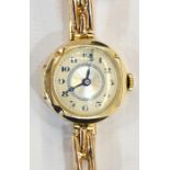 Lady's 9ct gold wristwatch with circular engine-turned dial, button winding and the expanding strap