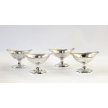 Early set of four pedestal George III silver salts of hexagonal boat-shaped design, ropetwist