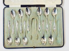 11 silver teaspoons and tongs, Sheffield 1912, in blue leather case