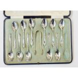 11 silver teaspoons and tongs, Sheffield 1912, in blue leather case