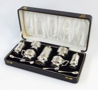 Early 20th century silver condiment set in black leather case, emblazoned with the initials 'F.J.